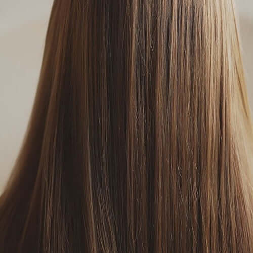 Long, healthy hair with a shiny finish, showcasing the results of Riman Botalab Deserticola Plus Conditioner.