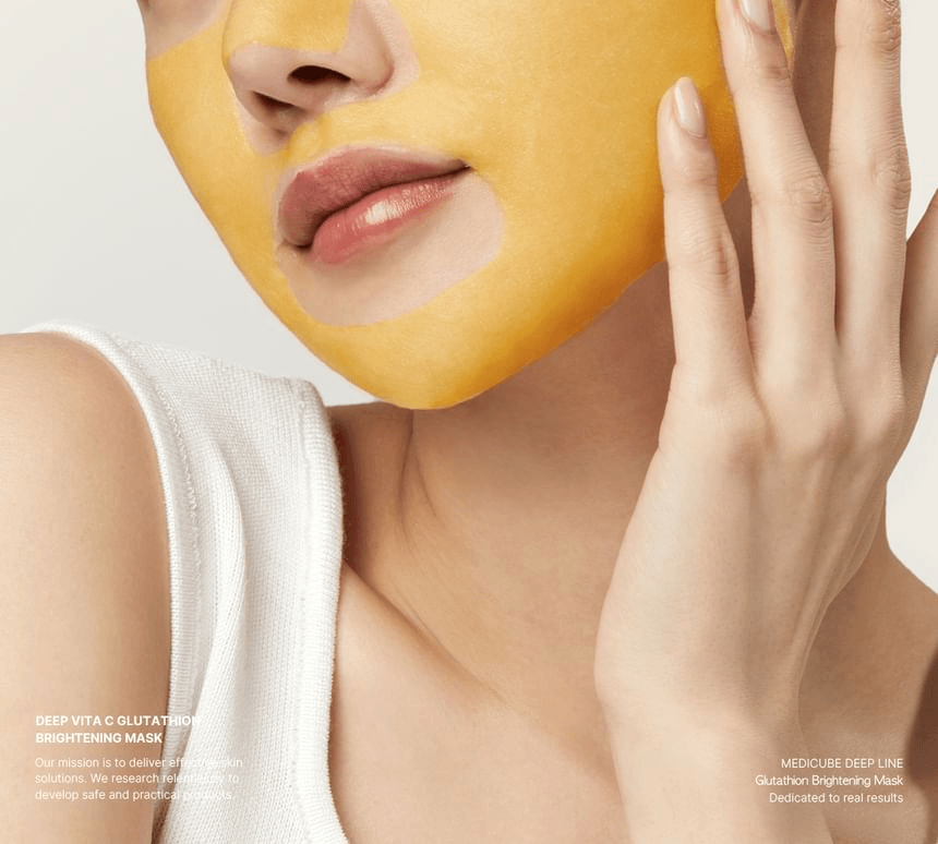 Medicube Deep Vita C Glutathione Brightening Beauty Mask being applied on a woman's face for glowing skin.