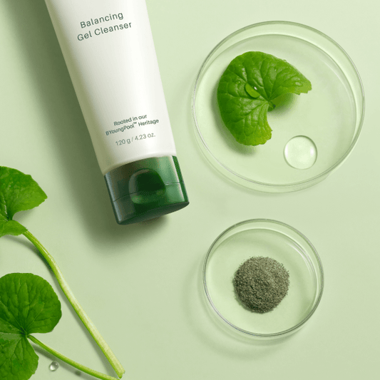 RIMAN ICD Balancing Gel Cleanser displayed with natural ingredients for balanced skin in green setting