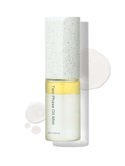 Riman ICD Two Phase Oil Mist bottle with textured lid and droplets, offering moisturizing nourishment for glowing skin.