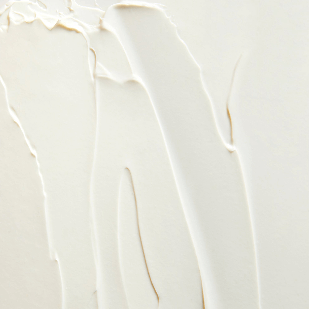 Close-up of creamy moisturizer texture, perfect for hydration and skin protection.