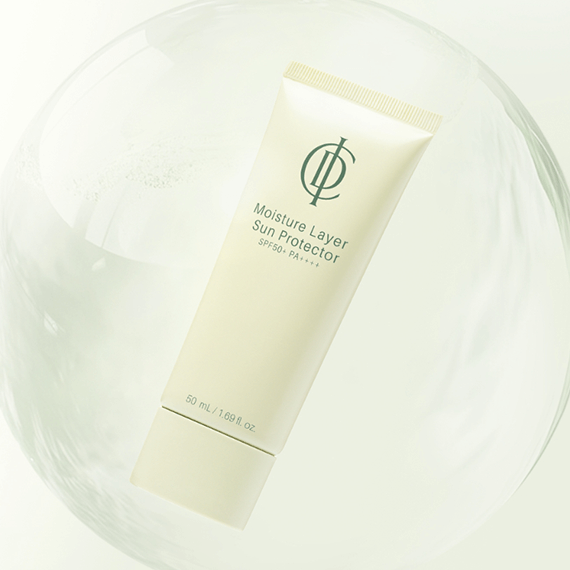 Riman ICD Moisture Layer Sunscreen in a tube against a soft background, 50 mL SPF 50+ for hydration and protection.