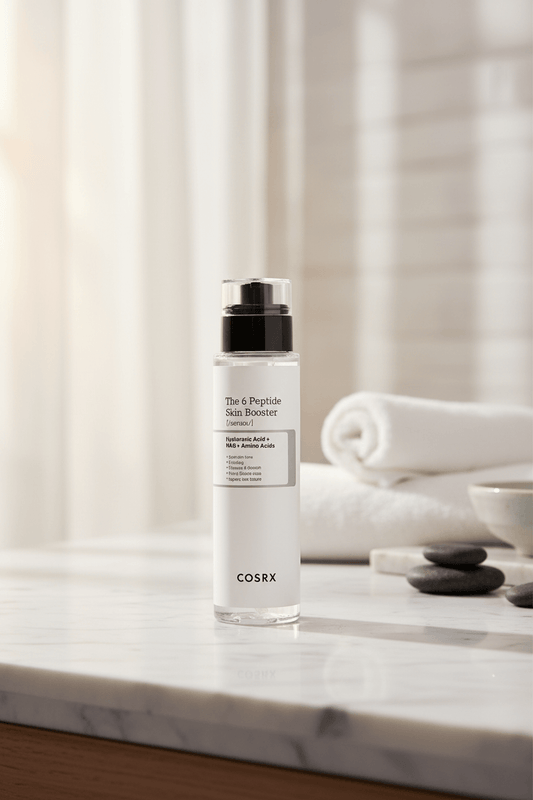 Cosrx skincare serum bottle on a white background