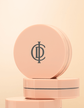 Riman ICD Makeup Luminous Glow Cushion packaging with logo, featuring a creamy peach color for radiant skin.