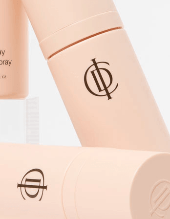 Riman ICD Makeup Set & Stay Makeup Spray bottles arranged for display, showcasing the elegant design and branding.