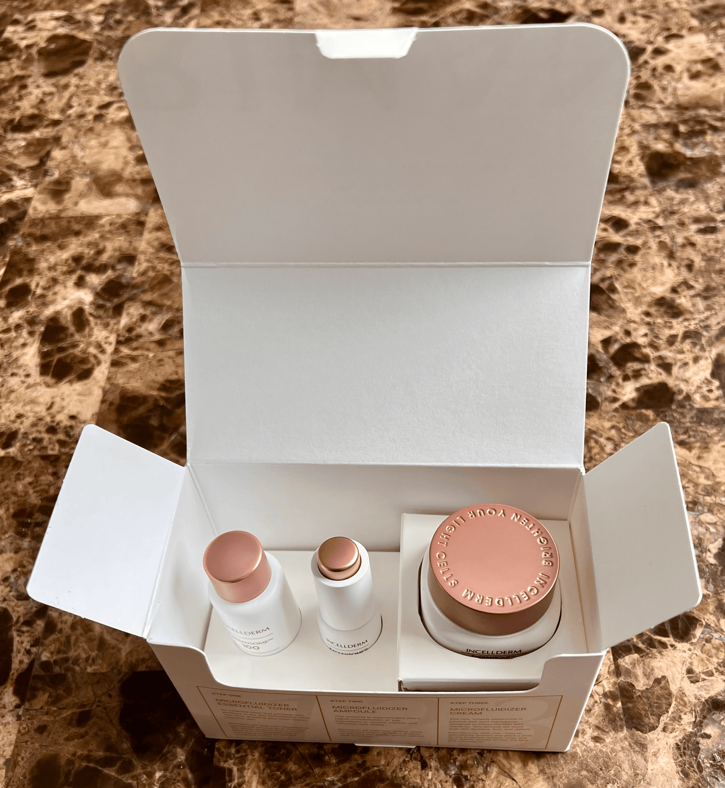 ICD Radiansome 100 Discovery Kit opened box showcasing travel-sized skincare products from Riman brand.