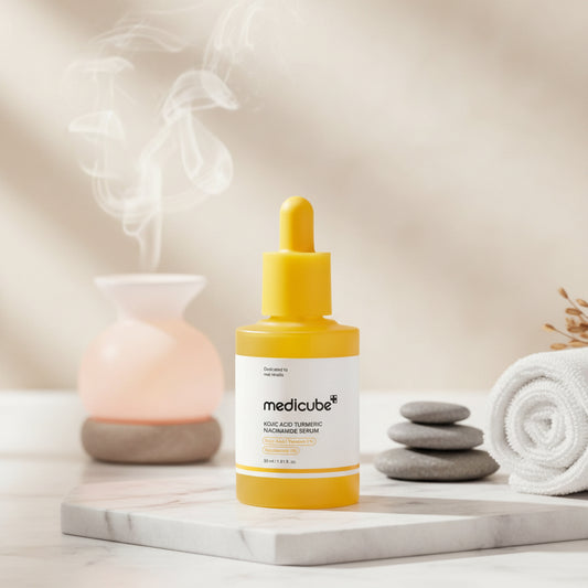 Yellow serum bottle with dropper labeled 'medicube' on a yellow circular background
