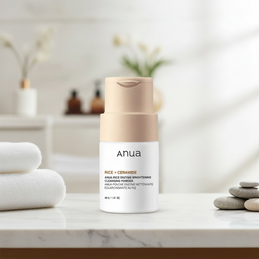 Anua skincare product with rice powder on a white background