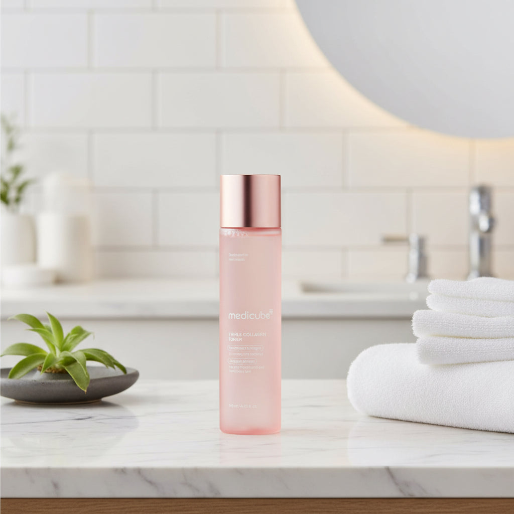 Medicube skincare bottle with rose gold cap on a white background