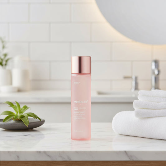 Medicube skincare bottle with rose gold cap on a white background