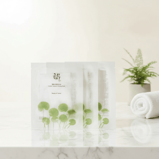 Beauty of Joseon Centella Asiatica Calming Mask packaging on marble with greenery.