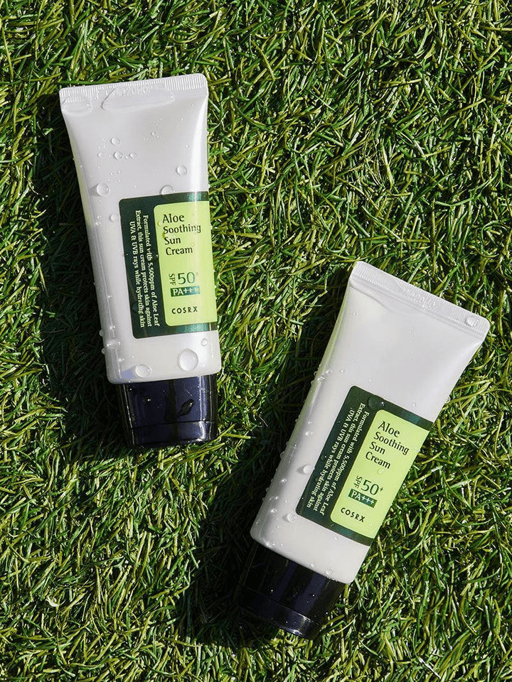 COSRX Aloe Soothing Sun Cream SPF50 | Korean Face Sunscreen on grass, showcasing lightweight and soothing sunblock.