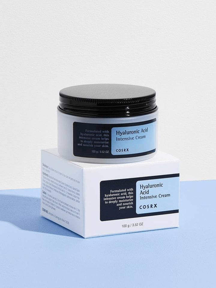 COSRX Hyaluronic Acid Intensive Cream | Korean Moisturizers in packaging on a blue surface.