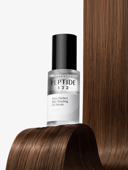 COSRX PEPTIDE-132 Ultra Perfect Hair Bonding Oil Serum | Korean Hair Care on smooth hair background.