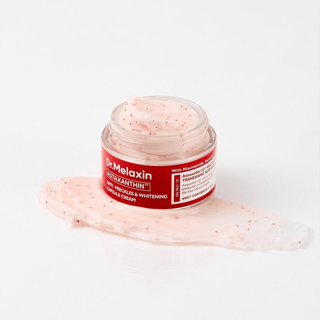 Dr Melaxin TX-Astaxanthin Anti-Dark Spot and Brightening Capsule Cream in jar with cream texture on surface.