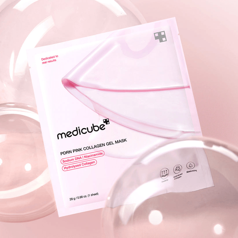 Medicube Salmon PDRN Pink Collagen Jelly Gel Mask packaging on a pink background with a sheet mask.