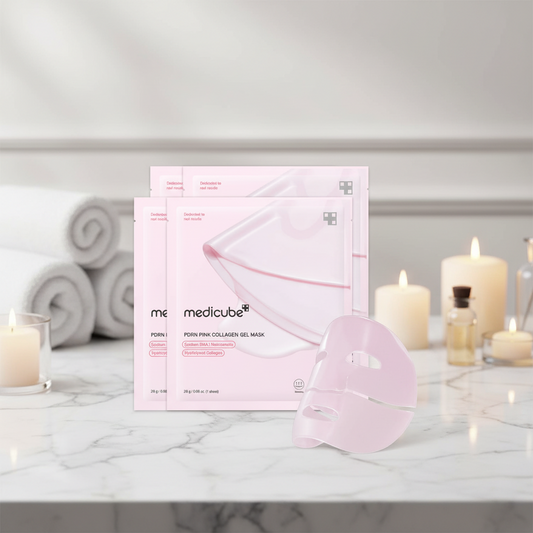 Medicube Salmon PDRN Pink Collagen Jelly Gel Mask displayed in a serene spa setting with candles.