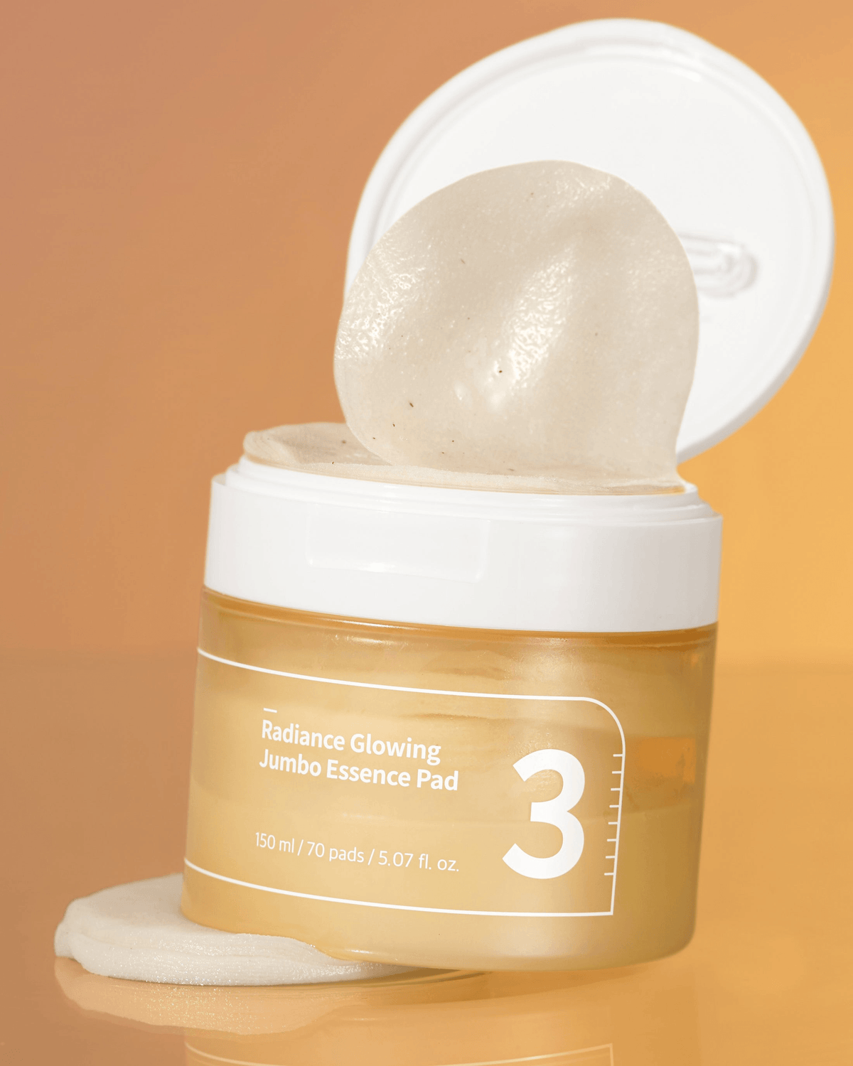 numbuzin No.3 Radiance Glowing Jumbo Essence Pads in a jar, featuring a gel-like pad ready for use.