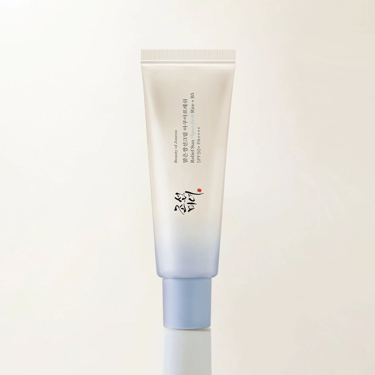Relief Sun Aqua-Fresh Rice B5 SPF50 sunscreen tube on a light background with a stylish design.