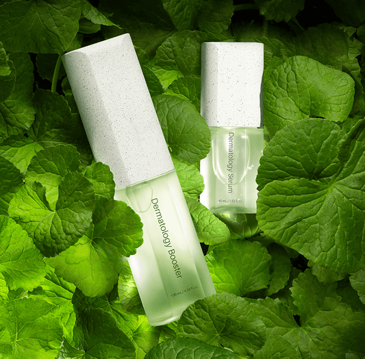 Riman ICD Dermatology booster and serum set surrounded by lush green leaves for deep hydration and skin radiance.